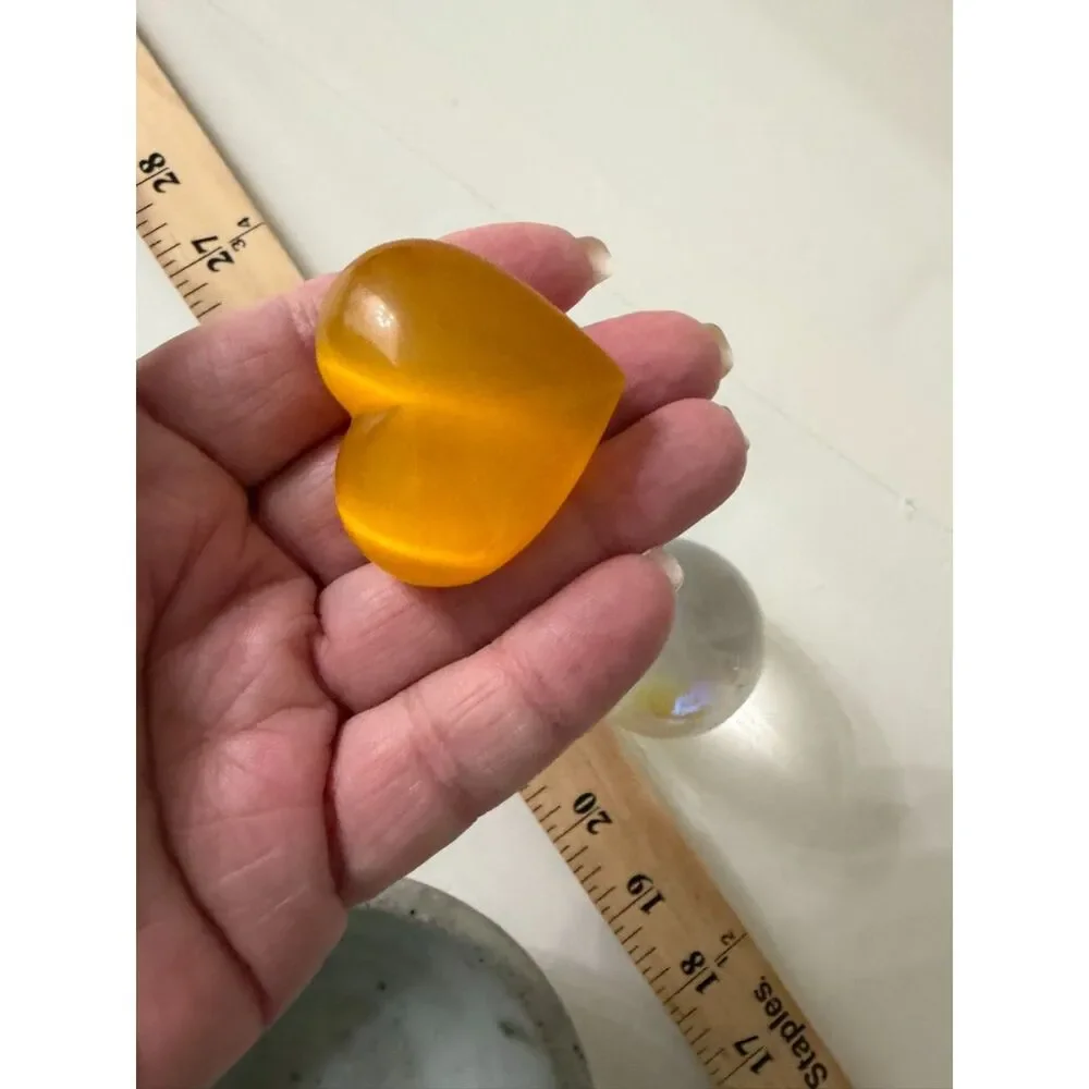 pottery bowl with clear crystal sphere and yellow cats eye heart gemstone